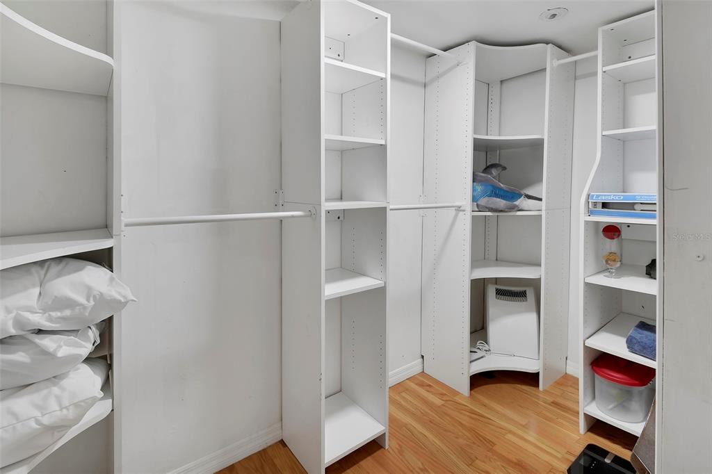 115 Juan Road DeBary, FL 32713 - Photo 26 of 41 a bedroom with a bed and a refrigerator