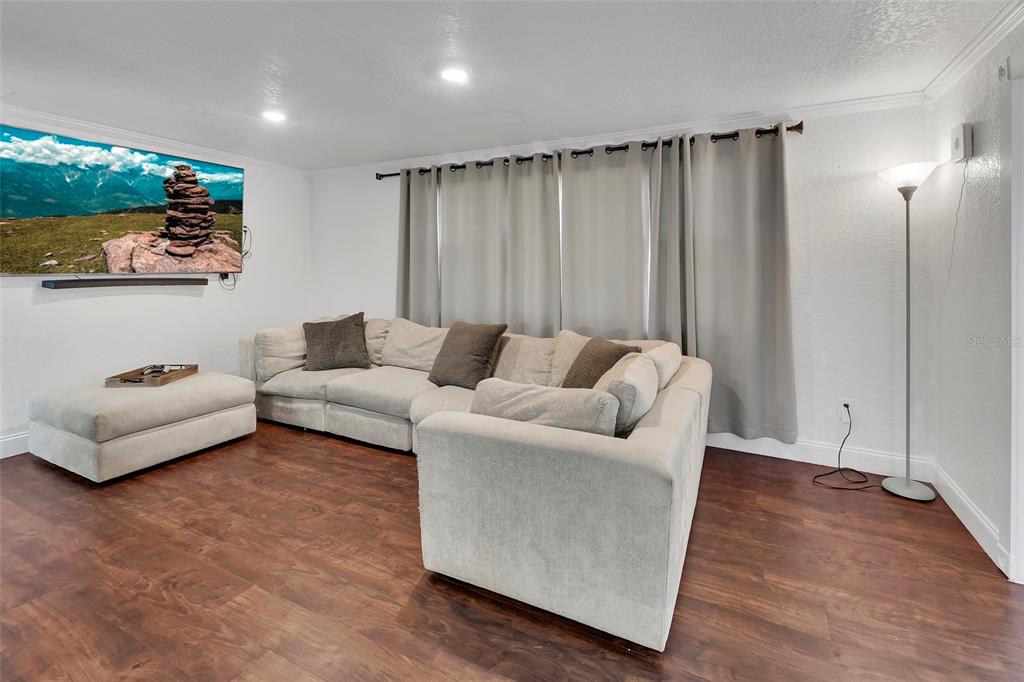 115 Juan Road DeBary, FL 32713 - Photo 3 of 41 a living room with furniture and a wooden floor