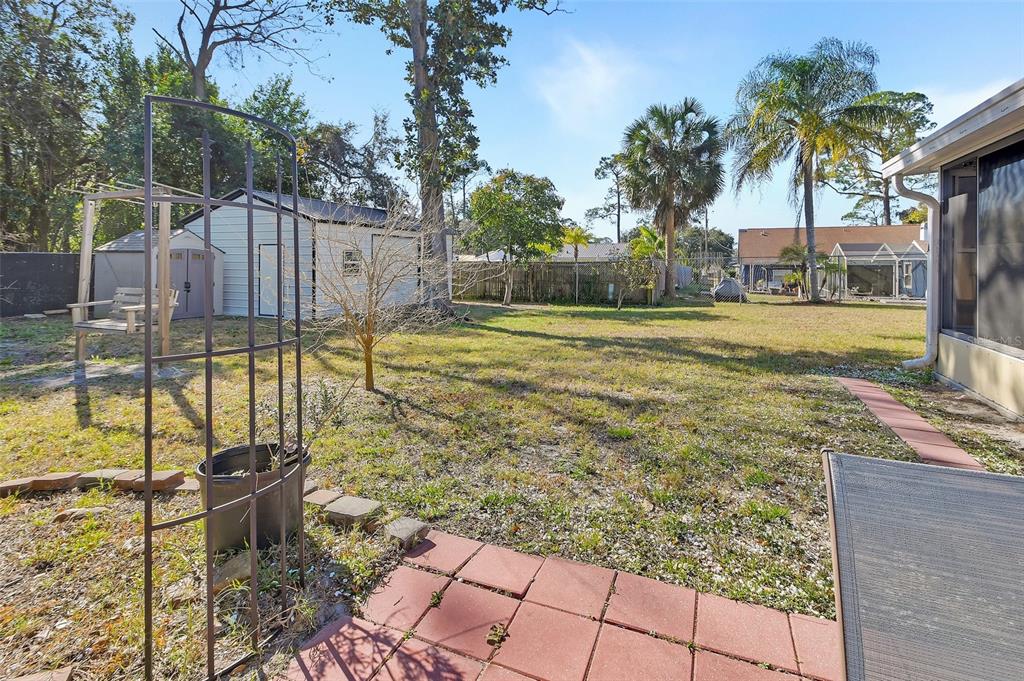 115 Juan Road DeBary, FL 32713 - Photo 33 of 41 a view of a swimming pool with a lounge chairs