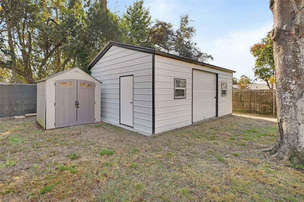 115 Juan Road DeBary, FL 32713 - Photo 36 of 41 a view of a house with a yard and garage
