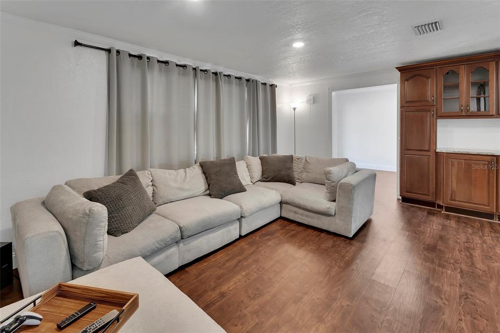 115 Juan Road DeBary, FL 32713 - Photo 4 of 41 a living room with furniture and a wooden floor