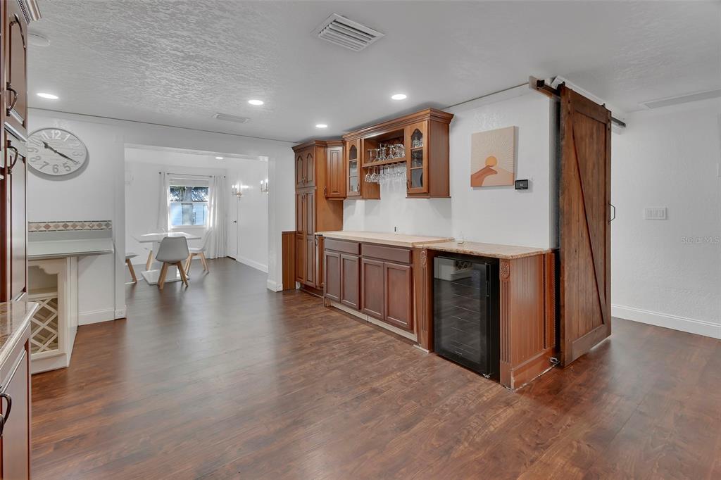115 Juan Road DeBary, FL 32713 - Photo 9 of 41 a view of kitchen with furniture and wooden floor