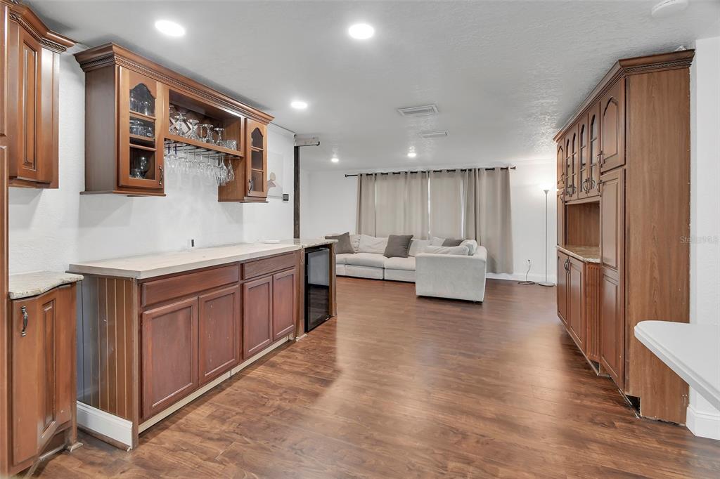 115 Juan Road DeBary, FL 32713 - Photo 10 of 41 a large white kitchen with stainless steel appliances granite countertop a refrigerator and a sink