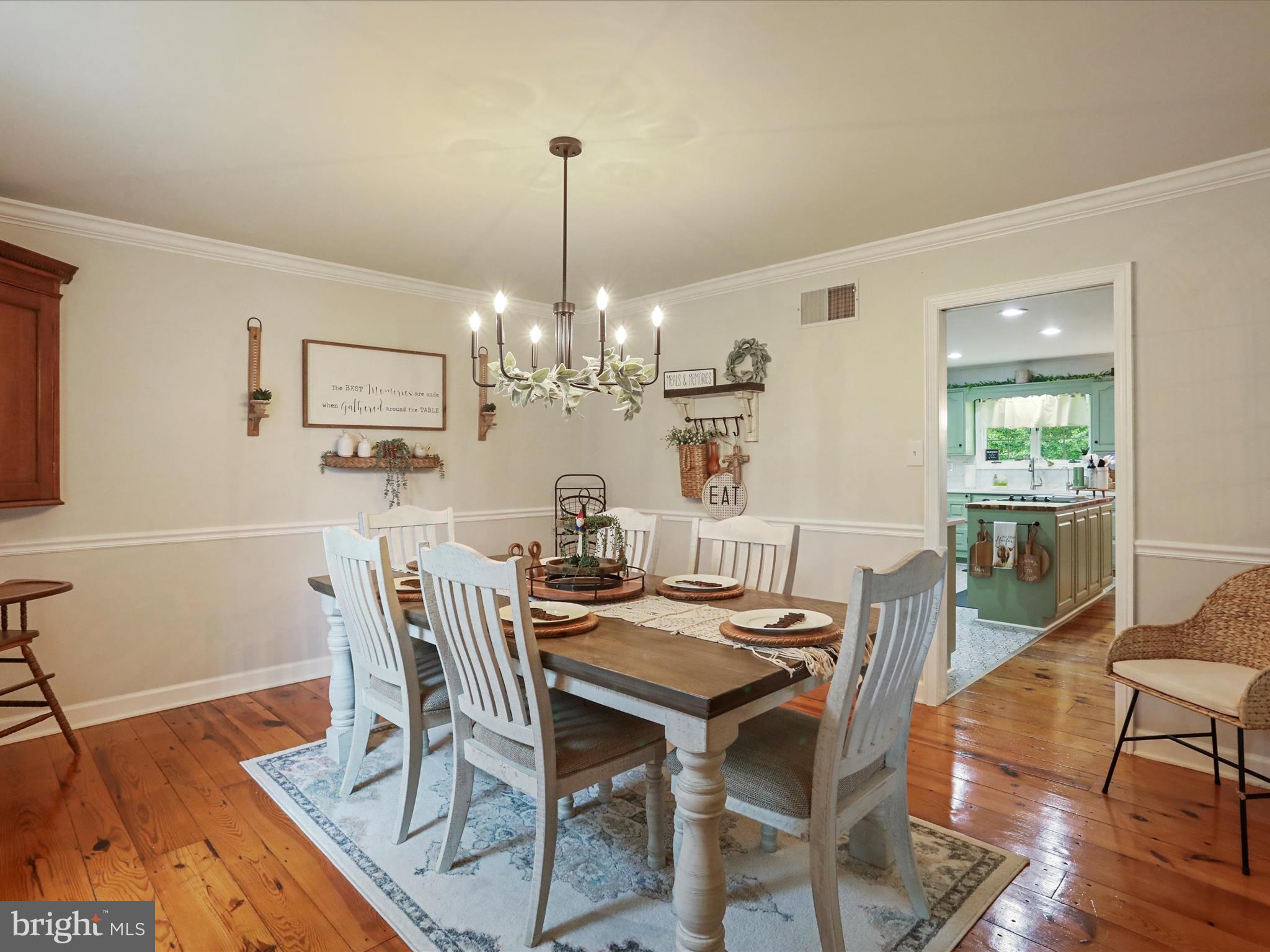 535 Bowling View Road Front Royal, VA 22630 - Photo 25 of 53 a view of a dining room with furniture a chandelier and wooden floor