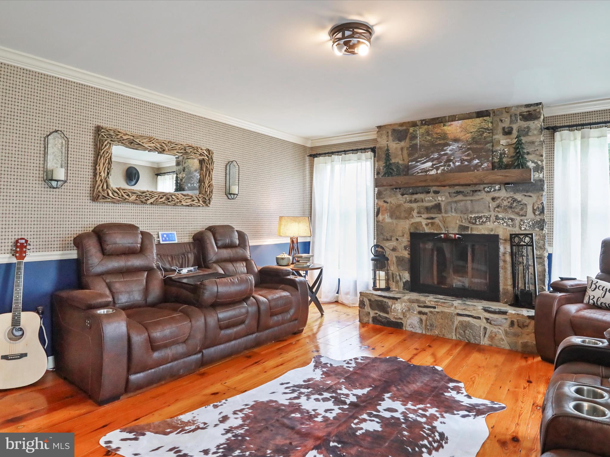 535 Bowling View Road Front Royal, VA 22630 - Photo 27 of 53 a living room with furniture a large window and a fireplace