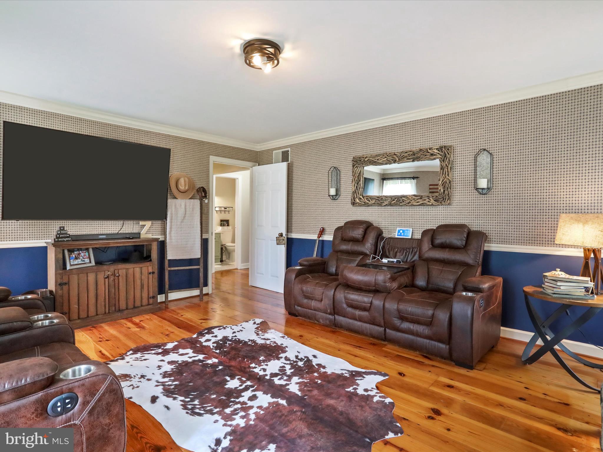 535 Bowling View Road Front Royal, VA 22630 - Photo 29 of 53 a living room with furniture and a flat screen tv
