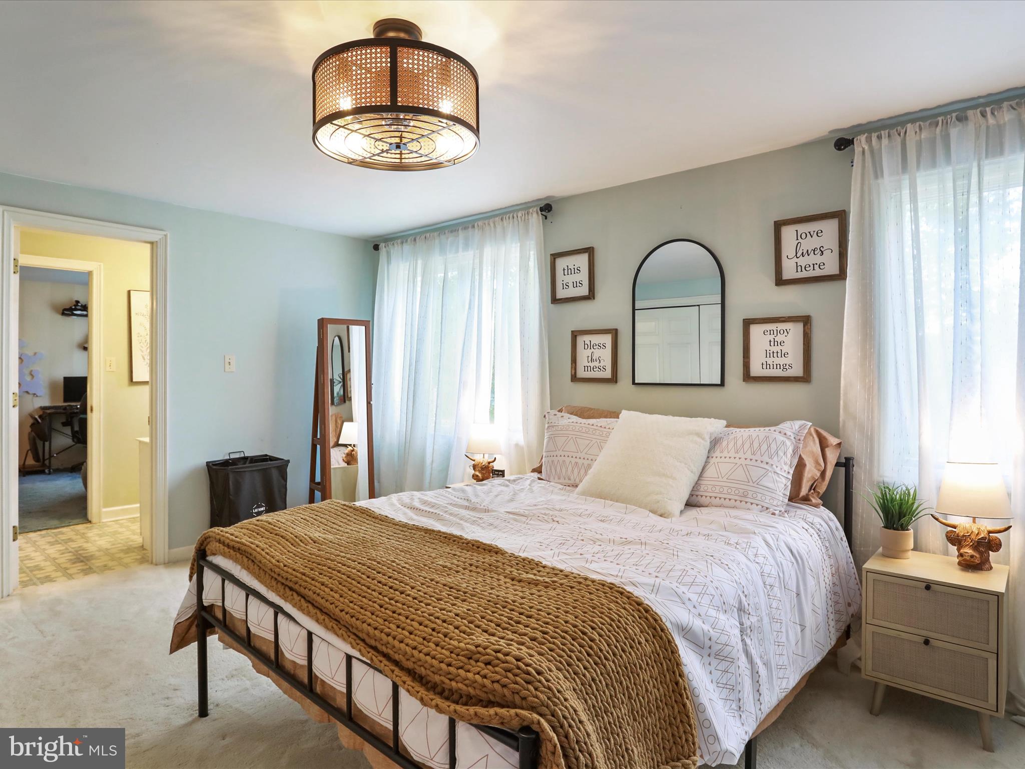 535 Bowling View Road Front Royal, VA 22630 - Photo 45 of 53 a bedroom with a bed and a chandelier