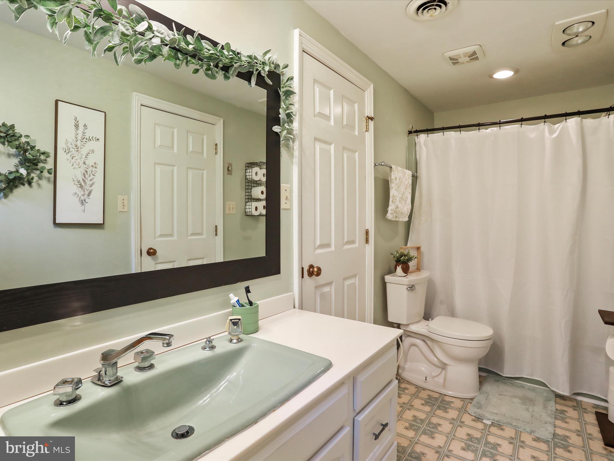 535 Bowling View Road Front Royal, VA 22630 - Photo 47 of 53 a bathroom with a sink and a mirror