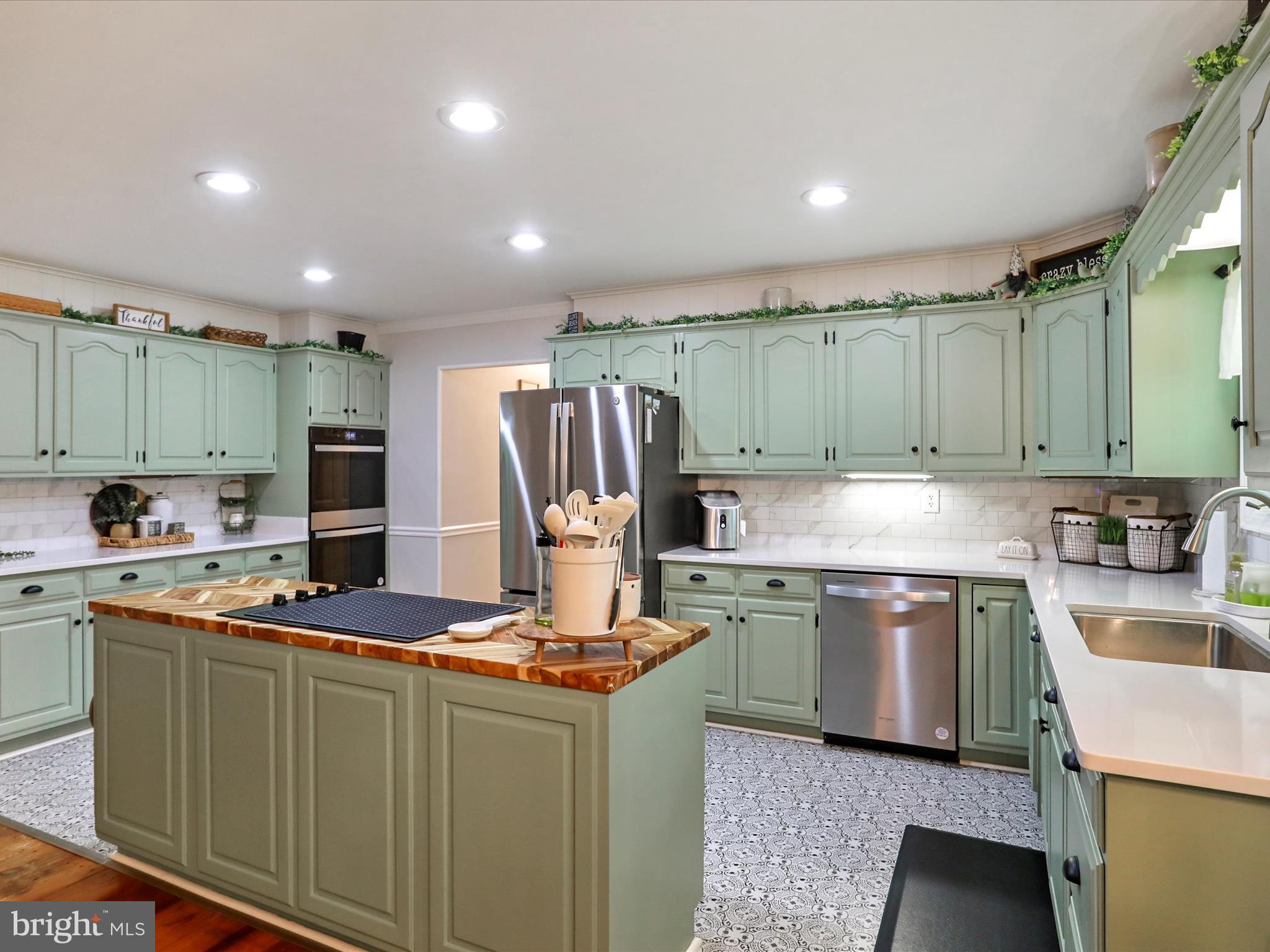 535 Bowling View Road Front Royal, VA 22630 - Photo 7 of 53 a kitchen with kitchen island stainless steel appliances a sink stove and refrigerator