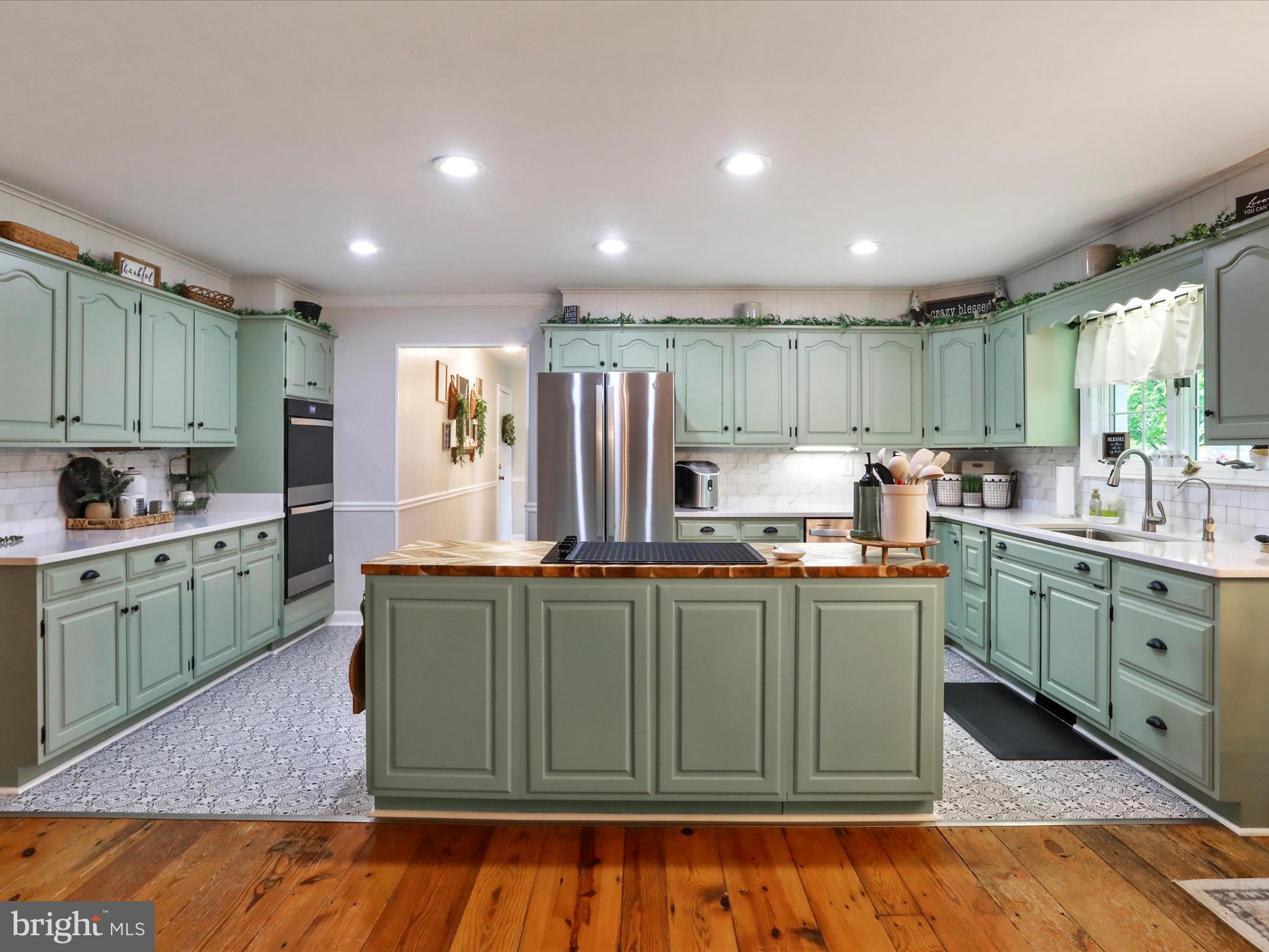 535 Bowling View Road Front Royal, VA 22630 - Photo 8 of 53 a kitchen with kitchen island granite countertop a sink cabinets and wooden floor