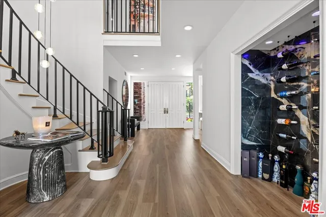 a view of entryway with wooden floor