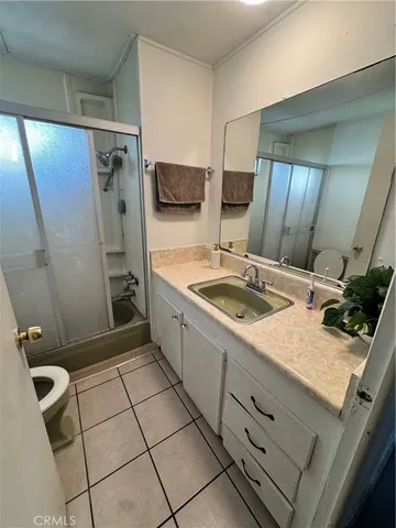 a kitchen with a sink toilet and shower