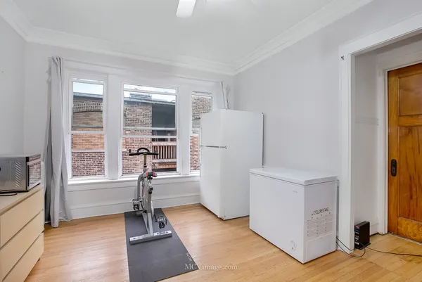 a view of a livingroom with furniture and a window