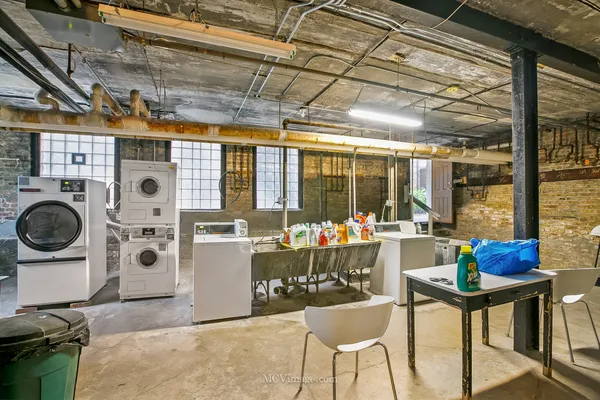a work room with furniture and a window