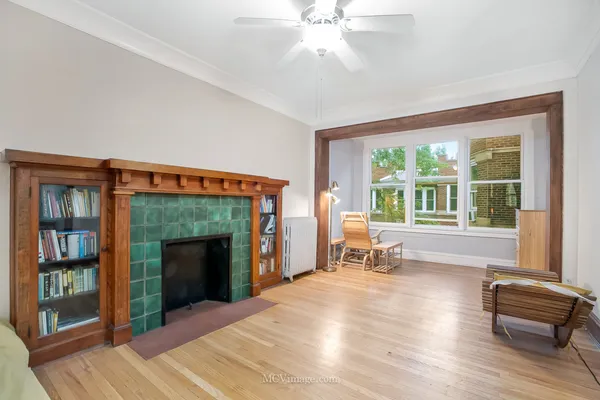 a bedroom with furniture and a fireplace