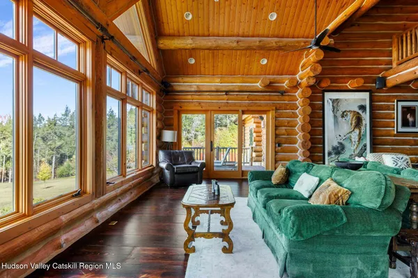 a bedroom with a large bed and a large window