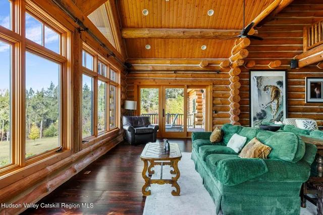 a bedroom with a large bed and a large window