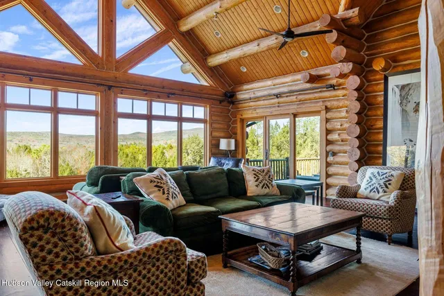 a view of a patio with table and chairs and potted plants