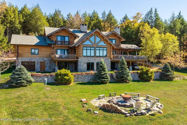 a view of a livingroom with furniture and a fireplace