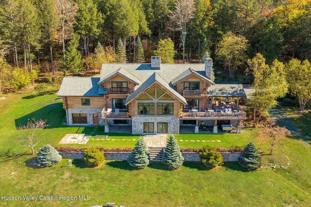 a bedroom with a bed and a fireplace