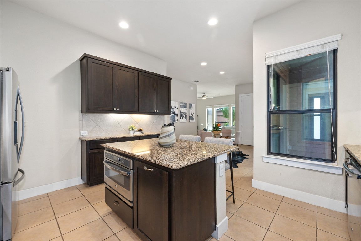 405 Penny Kathleen Court Austin, TX 78717 - Photo 13 of 30 a kitchen with stainless steel appliances granite countertop a sink and a stove