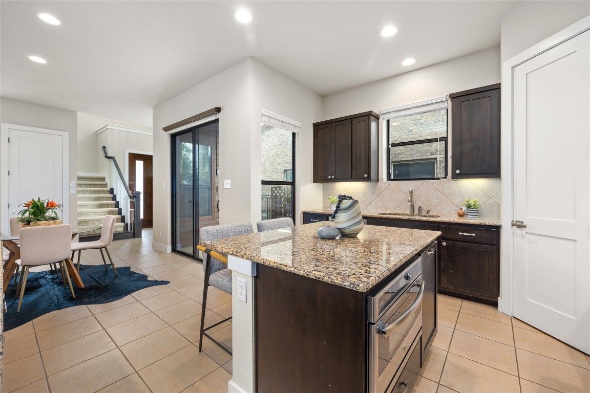 405 Penny Kathleen Court Austin, TX 78717 - Photo 14 of 30 a kitchen with a sink refrigerator and cabinets