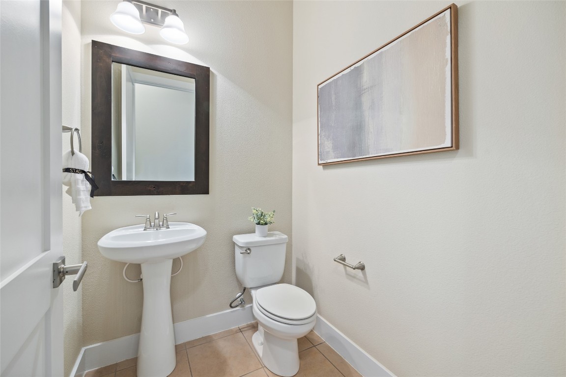405 Penny Kathleen Court Austin, TX 78717 - Photo 15 of 30 a bathroom with a toilet sink and mirror