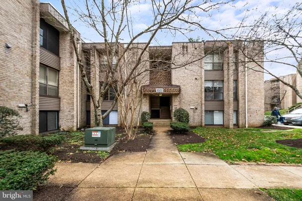 a view of a building with a yard