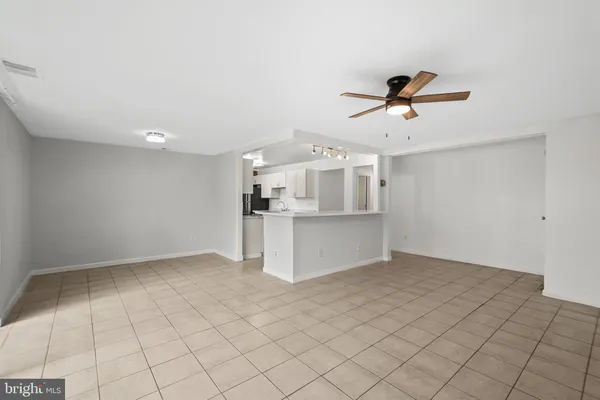 a view of a kitchen with microwave and cabinets
