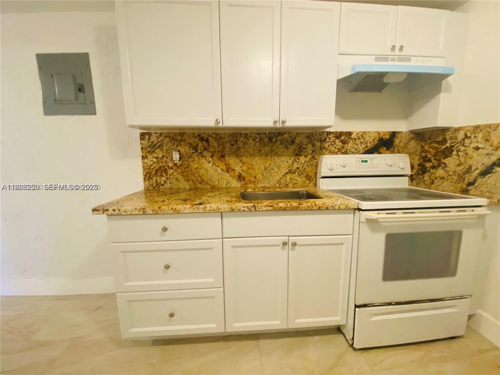 2230 Northwest 51st Terrace, Unit 2 Miami, FL 33142 - Photo 2 of 10 a view of washer and dryer