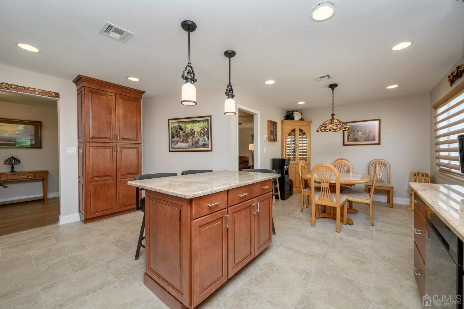 3 Bow Drive Brick, NJ 08723 - Photo 13 of 36 a kitchen that has a lot of cabinets in it and wooden floors