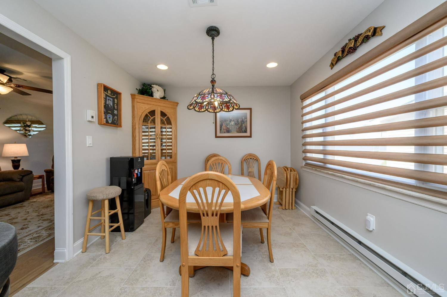 3 Bow Drive Brick, NJ 08723 - Photo 17 of 36 a view of a dining room with furniture window and wooden floor
