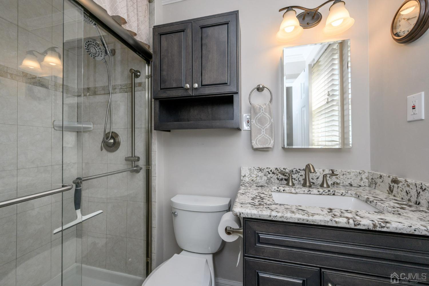 3 Bow Drive Brick, NJ 08723 - Photo 20 of 36 a bathroom with a granite countertop sink toilet and shower