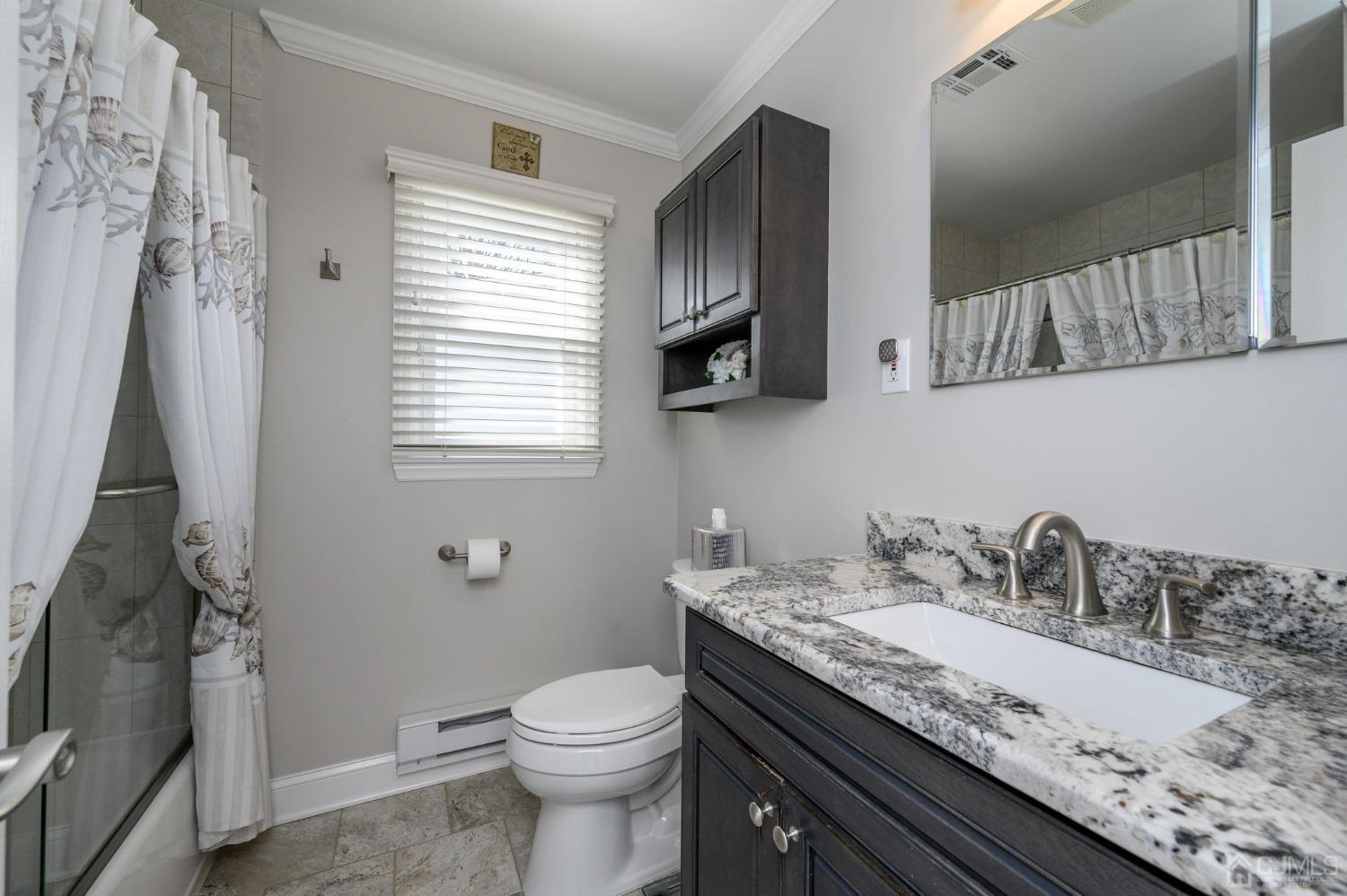 3 Bow Drive Brick, NJ 08723 - Photo 23 of 36 a bathroom with a granite countertop sink a toilet and a mirror