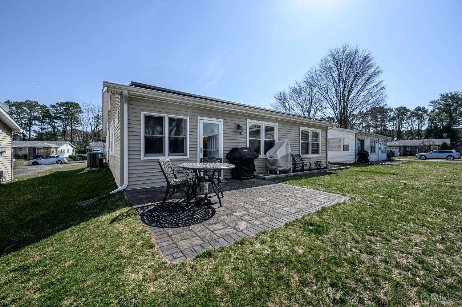 3 Bow Drive Brick, NJ 08723 - Photo 27 of 36 a view of a house with backyard sitting area and garden