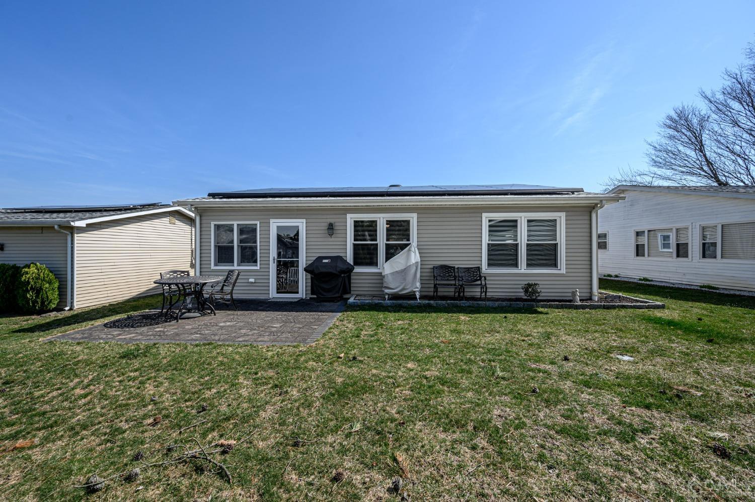3 Bow Drive Brick, NJ 08723 - Photo 28 of 36 a view of a house with backyard sitting area and a tree