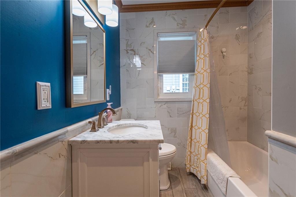 357 Carley Avenue Sharon, PA 16146 - Photo 19 of 32 a bathroom with a granite countertop sink toilet and shower