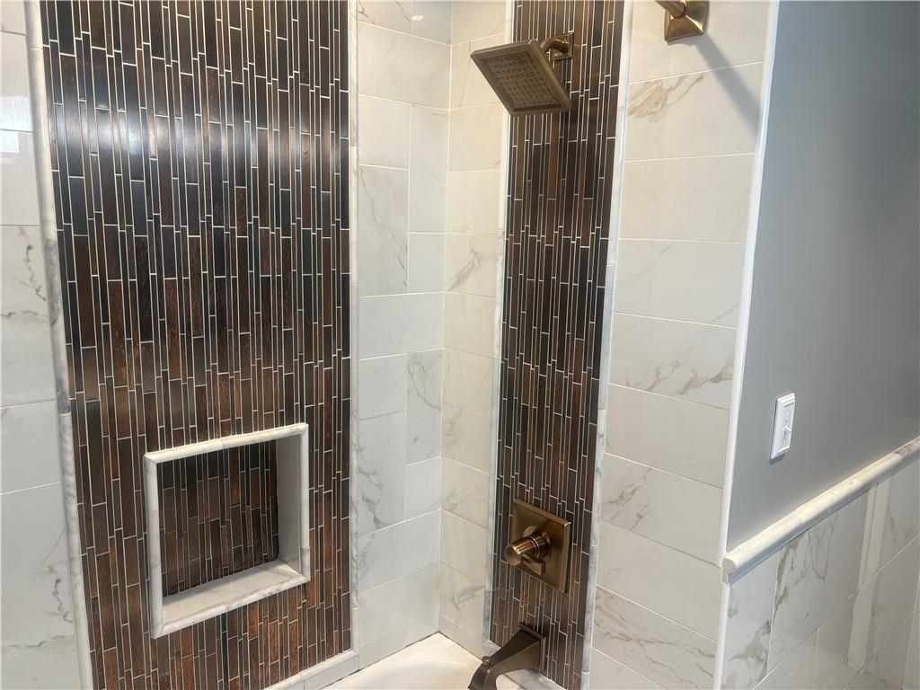 357 Carley Avenue Sharon, PA 16146 - Photo 21 of 32 a bathroom with a shower and a toilet