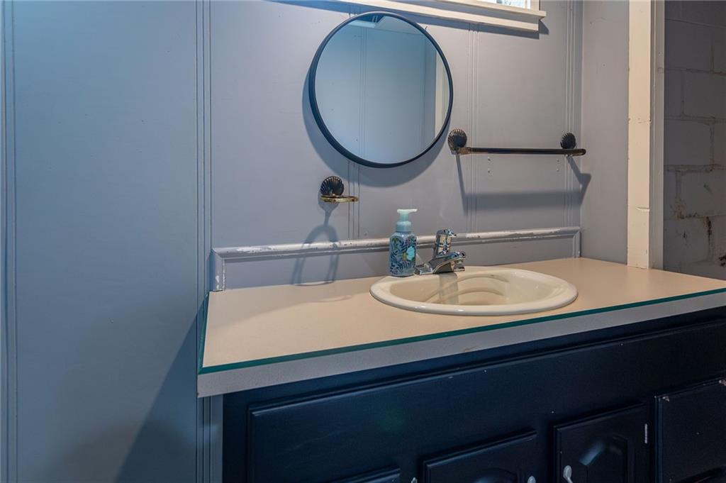 357 Carley Avenue Sharon, PA 16146 - Photo 25 of 32 a bathroom with a sink and a mirror