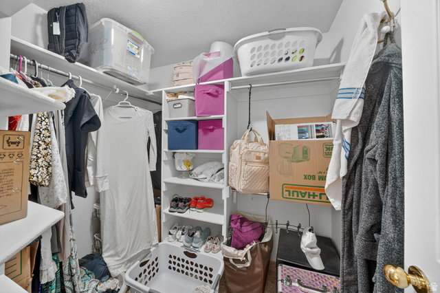 883 East 700 South Springville, UT 84663 - Photo 39 of 59 Customizable closet storage system featuring multiple shelving units and hanging rods for versatile organization