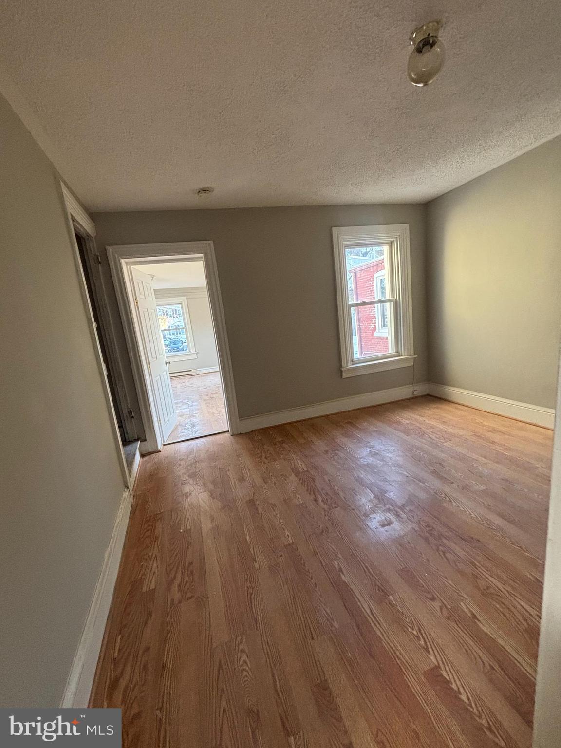 624 Poplar Street Lancaster, PA 17603 - Photo 12 of 25 wooden floor in an empty room with a window