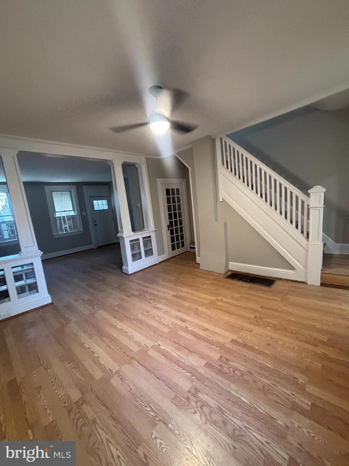 624 Poplar Street Lancaster, PA 17603 - Photo 4 of 25 an empty room with wooden floor and windows
