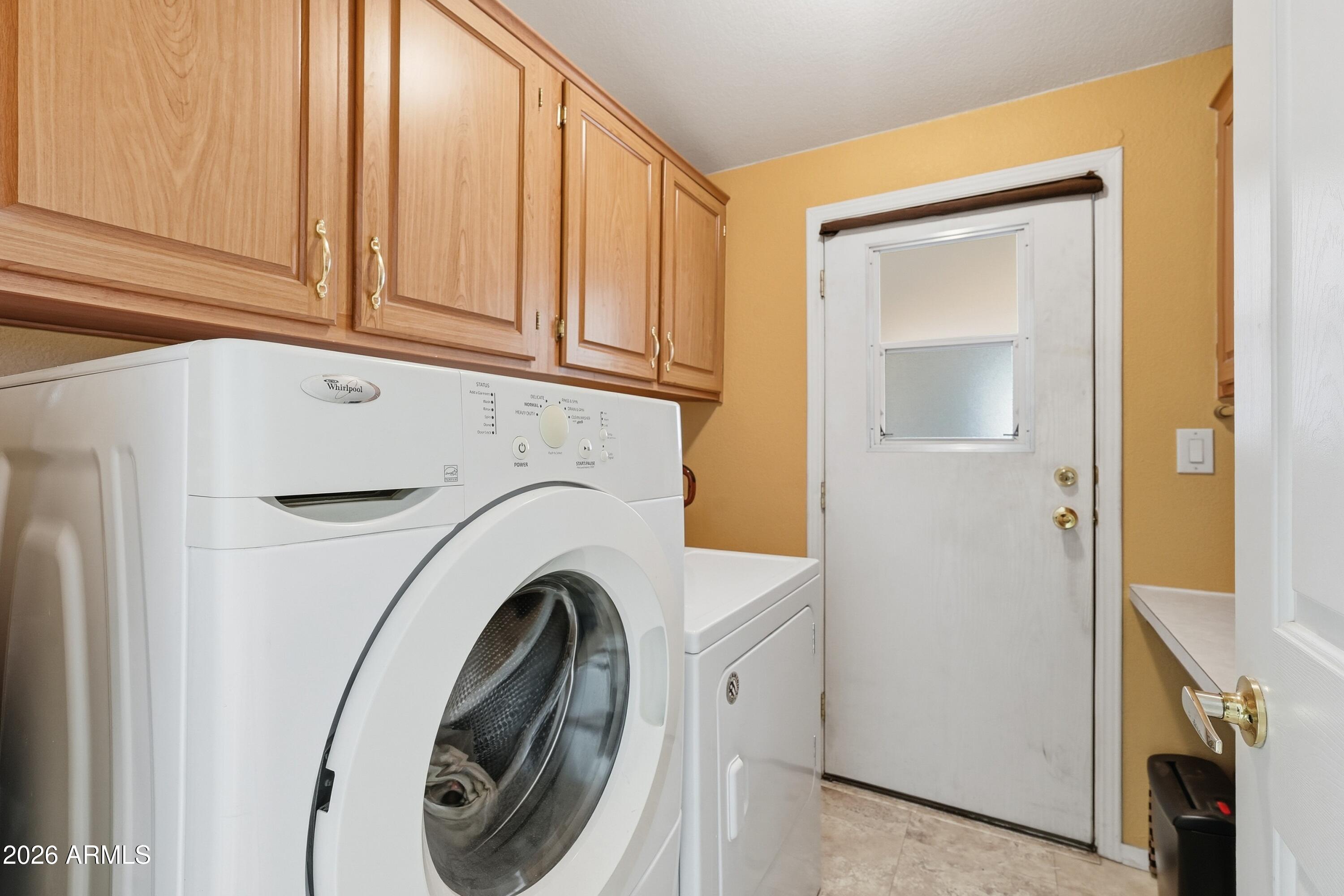 2550 South Ellsworth Road, Unit 208 Mesa, AZ 85209 - Photo 28 of 44 Laundry room with desk