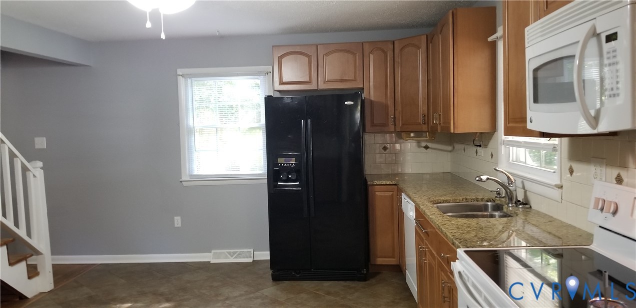 139 Pike Street Gum Spring, VA 23065 - Photo 2 of 11 a kitchen with a refrigerator stove and sink