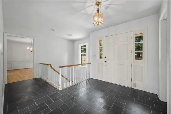 wooden floor fireplace and natural light in room