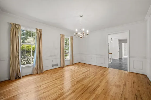 a view of an empty room and fire place