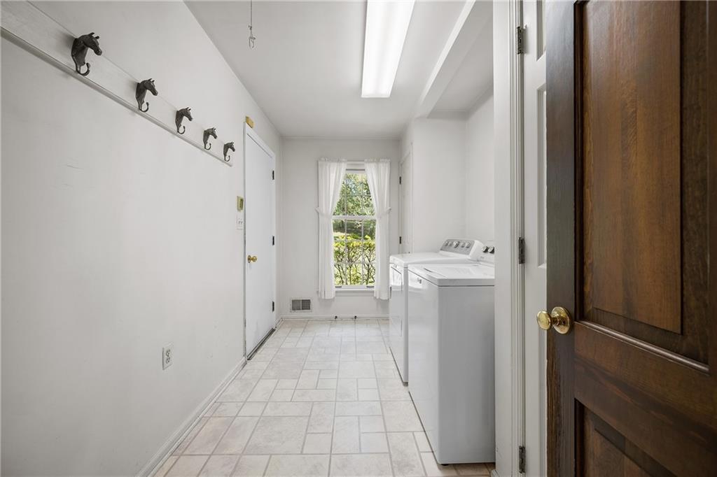 45 Stonedale Road Sewickley, PA 15143 - Photo 24 of 28 a view of a hallway with white walls and a window
