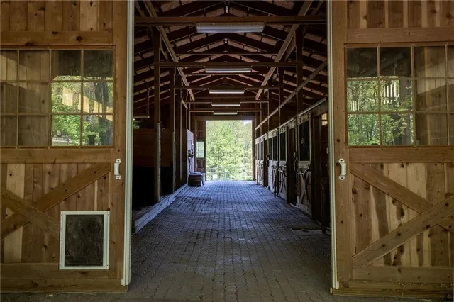 a view of a room with wooden floor and outdoor space