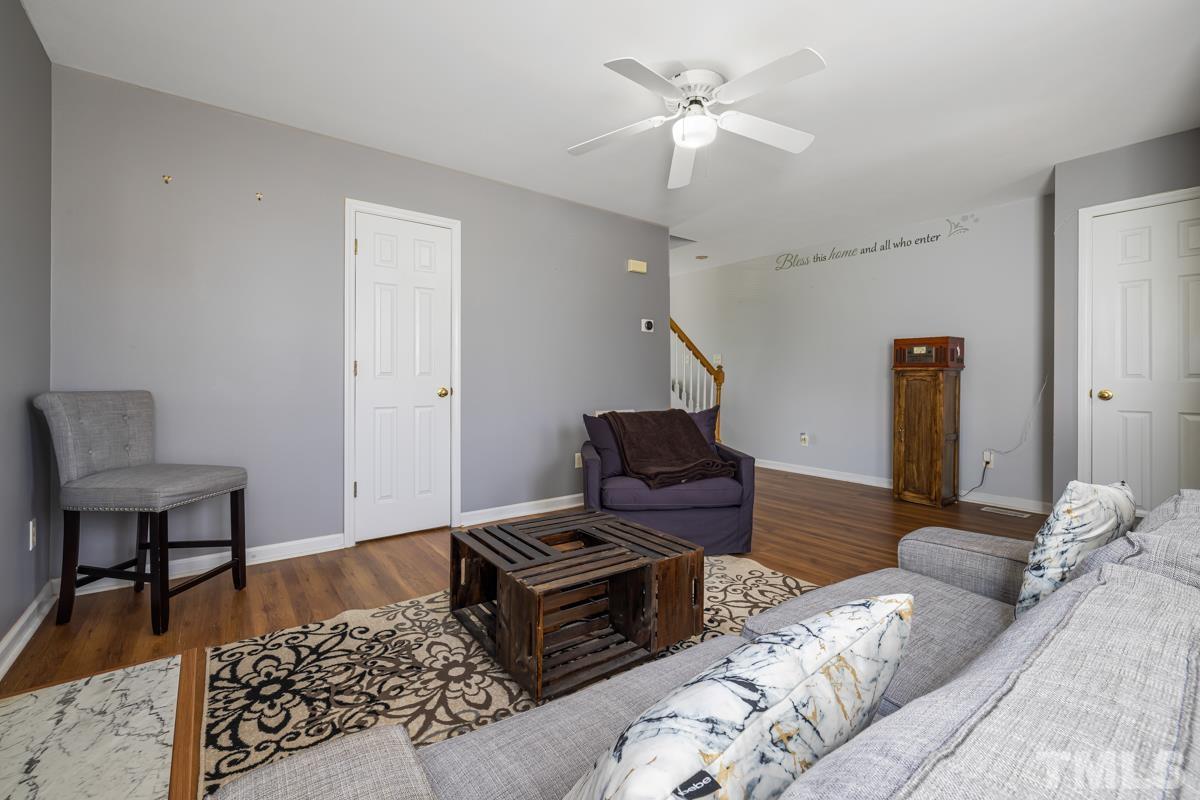 4905 Windproof Way Raleigh, NC 27616 - Photo 12 of 39 a living room with furniture and a piano