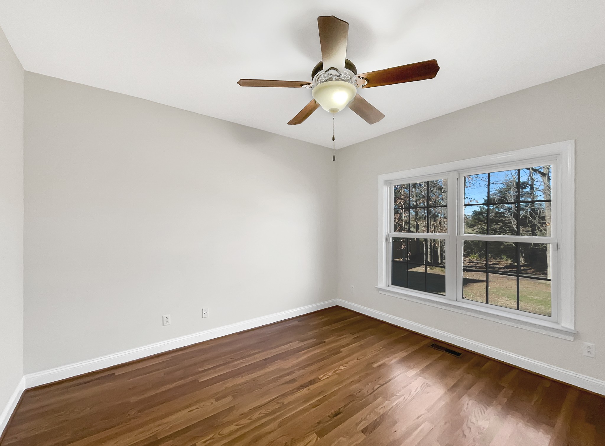 7302 Kempton Court Fairview, TN 37062 - Photo 18 of 28 a view of an empty room with wooden floor and a window